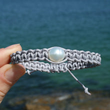 Load image into Gallery viewer, Thick Grey Macrame bracelet featuring an Australian South Sea Pearl, Circle Drop in shape, 10.3 mm in size, White in colour.  (J3319)  This bracelet is made from water and colorfast nylon material for heavy duty wear and tear, features no glue and no metal parts   
