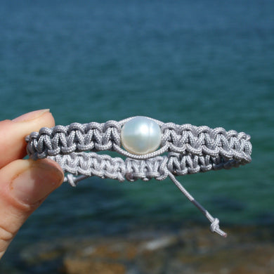 Thick Grey Macrame bracelet featuring an Australian South Sea Pearl, Circle Drop in shape, 10.3 mm in size, White in colour.  (J3319)  This bracelet is made from water and colorfast nylon material for heavy duty wear and tear, features no glue and no metal parts   