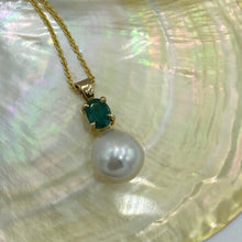 Load image into Gallery viewer, Elegant Emerald pendant featuring a beautiful Pink White Australian pearl, Circle Drop in shape, 13.2mm in size and high lustre This pendant features and Oval shape facetted natural Emerald which is claw set in a 9ct yellow gold hand crafted pendant J3390