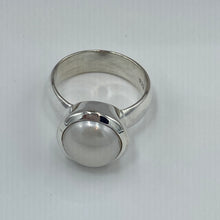 Load image into Gallery viewer, This solid 925 Sterling Silver Ring features a fully protected cup so the pearl is fully protected making this the perfect ring for heavy wear conditions. It features a White 12mm Button shaped Freshwater Pearl. Available in Sizes 7, 8 , 9, 10 and 11