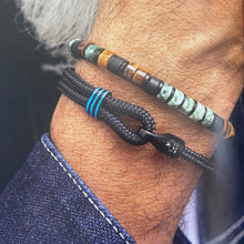 Load image into Gallery viewer, Stunning new range of Men's Stainless steel and nautical rope jewellery, hand made in Amsterdam and designed with strength to be worn 24/7
Black 4mm rope with Black 6mm Hook
In stock now size S
Also available in other colors and sizes 