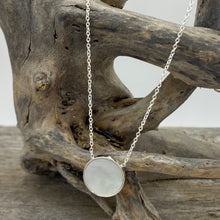 Load image into Gallery viewer, Sterling silver pendant and chain featuring a round bezel set reversible disc of Blue Paua shell on one side and White Mother of Pearl shell on the other side.
Disc size is 14mm in diameter and 2.5mm in thickness with an adjustable chain length from 39cm to 42cm