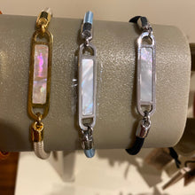 Load image into Gallery viewer, Stunning new range of Ladies Stainless steel and nautical rope jewellery, hand made in Amsterdam and designed with strength to be worn 24/7
This stunning rope Mother of Pearl shell bracelet with Black rope and Gold fittings is the perfect bracelet for a touch of glowing shell teamed with the classy rope and durability of stainless steel setting around the pearl shell
One size
Also available in other colors
Mix and match or stack with other Pig and Hen bracelets 