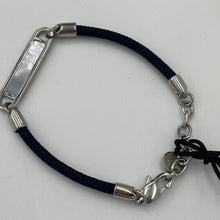 Load image into Gallery viewer, Stunning new range of Ladies Stainless steel and nautical rope jewellery, hand made in Amsterdam and designed with strength to be worn 24/7
This stunning rope Mother of Pearl shell bracelet with Navy Blue rope and Silver fittings is the perfect bracelet for a touch of glowing shell teamed with the classy rope and durability of stainless steel setting around the pearl shell
One size
Also available in other colors
Mix and match or stack with other Pig and Hen bracelets 