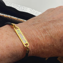 Load image into Gallery viewer, Stunning new range of Ladies Stainless steel and nautical rope jewellery, hand made in Amsterdam and designed with strength to be worn 24/7
This stunning rope Mother of Pearl shell bracelet with Black rope and Gold fittings is the perfect bracelet for a touch of glowing shell teamed with the classy rope and durability of stainless steel setting around the pearl shell
One size
Also available in other colors
Mix and match or stack with other Pig and Hen bracelets 