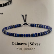 Load image into Gallery viewer, Stunning new range of Unisex Stainless steel and nautical rope jewellery, hand made in Amsterdam and designed with strength to be worn 24/7
Blue Lapis and Grey 4mm semi precious stones with a 4mm Silver slider
Adjustable size
In stock now size M
Also available in other colors and sizes 