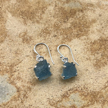 Load image into Gallery viewer, <p>Sterling silver claw set shepherds hook style earrings featuring stunning Rough cut Aquamarine gemstones</p> <p>The stones vary in shape but are roughly rectangle and 11 x 12mm in size</p> <p>Team your aquamarine earrings with an aquamarine necklace for a WOW effect</p>