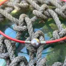 Load image into Gallery viewer, <p>Stunning Tahitian South Sea pearl necklet featuring a Near Round shape pearl that is 11.5mm in size and a beautiful Aubergine with Pink hues in color.</p> <p>This pearl has High lustre and is flawless. </p> <p>The necklace is leather and has a silver Cartier clasp and is a rich Pindan in color.</p> <p><span style="font-size: 0.875rem;">The length is adjustable from 44 to 47cm using the extension chain</span></p> <p><span style="font-size: 0.875rem;">J3350</span></p>