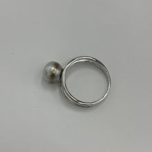 Load image into Gallery viewer, This split band ring features an Abrolhos Islands Australian South Sea Pearl set in 925 sterling silver and rhodium coated for a non tarnish finish. The pearl is button in shape, and 9.2mm in size and a pastel Grey Blue with Brown hues color . These pastel tones are typical of the pearls grown off the Abrolhols Islands of WA Size Q / 58 J3436