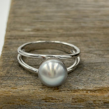 Load image into Gallery viewer, This split band ring features an Abrolhos Islands Australian South Sea Pearl set in 925 sterling silver and rhodium coated for a non tarnish finish. The pearl is button in shape, and 9.2mm in size and a pastel Grey Blue with Brown hues color . These pastel tones are typical of the pearls grown off the Abrolhols Islands of WA Size Q / 58 J3436