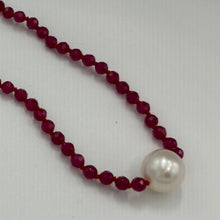 Load image into Gallery viewer, Australian South Sea pearl bracelet with 3mm faceted ruby gemstones and a sterling silver peanut clasp This stunning deep ruby red bracelet features a single White Australian South Sea pearl, button shape, 9.4mm in size, White in color, with light natural 'birthmarks' The length including the clasp is 19cm J3445