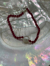Load image into Gallery viewer, Australian South Sea pearl bracelet with 3mm faceted ruby gemstones and a sterling silver peanut clasp This stunning deep ruby red bracelet features a single White Australian South Sea pearl, button shape, 9.4mm in size, White in color, with light natural 'birthmarks' The length including the clasp is 19cm J3445
