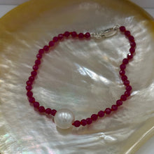Load image into Gallery viewer, Australian South Sea pearl bracelet with 3mm faceted ruby gemstones and a sterling silver peanut clasp This stunning deep ruby red bracelet features a single White Australian South Sea pearl, button shape, 9.4mm in size, White in color, with light natural 'birthmarks' The length including the clasp is 19cm J3445