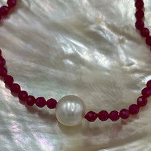 Load image into Gallery viewer, Australian South Sea pearl bracelet with 3mm faceted ruby gemstones and a sterling silver peanut clasp This stunning deep ruby red bracelet features a single White Australian South Sea pearl, button shape, 9.4mm in size, White in color, with light natural 'birthmarks' The length including the clasp is 19cm J3445