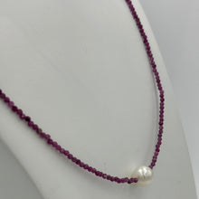 Load image into Gallery viewer, Australian South Sea pearl necklace with 2mm faceted deep red ruby gemstones and a 925 Sterling silver parrot clasp. This stunning necklace features a single White Australian South Sea pearl , Round in shape, 9.3mm in size, and White with Pink hues in color. This pearl has excellent lustre and is AAA grade The overall length is 48cm J3449
