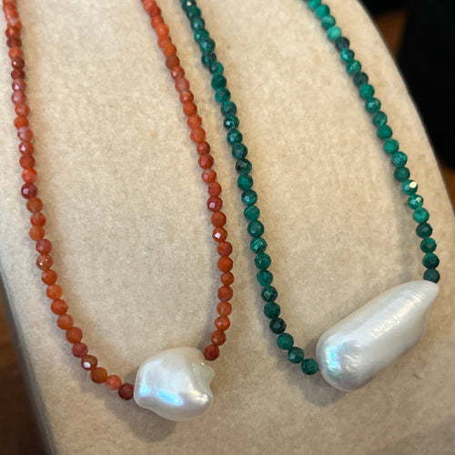 <p><span>This necklace features a white Freshwater BIWA Pearl on a necklace of 2.5mm facetted  malachite gemstones with a sterling silver peanut clasp</span></p> <p><span>The pearl is 10 x 23mm in size</span></p> <p>The overall length is 45cm</p>