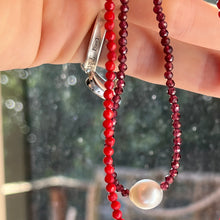Load image into Gallery viewer, <p><span>Australian South Sea pearl necklace with facetted 3mm Garnet gemstones and a sterling silver peanut clasp</span></p> <p><span>This stunning necklace features an Australian South Sea pearl , Button in shape, and 12.1mm in size. It is white with Subtle Pink hues in color</span></p> <p>The overall length is 46.5cm</p> <p>Good lustre and light natural 'birthmarks'</p> <p><span>J3345</span></p>
