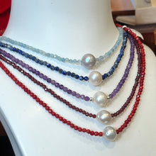 Load image into Gallery viewer, <p><span>Australian South Sea pearl necklace with facetted 3mm Garnet gemstones and a sterling silver peanut clasp</span></p> <p><span>This stunning necklace features an Australian South Sea pearl , Button in shape, and 12.1mm in size. It is white with Subtle Pink hues in color</span></p> <p>The overall length is 46.5cm</p> <p>Good lustre and light natural 'birthmarks'</p> <p><span>J3345</span></p>