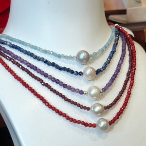 <p><span>Australian South Sea pearl necklace with facetted 3mm Garnet gemstones and a sterling silver peanut clasp</span></p> <p><span>This stunning necklace features an Australian South Sea pearl , Button in shape, and 12.1mm in size. It is&nbsp; white with Subtle Pink hues in color</span></p> <p>The overall length is 46.5cm</p> <p>Good lustre and light natural 'birthmarks'</p> <p><span>J3345</span></p>