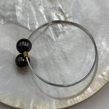 Load image into Gallery viewer, This double pearl bangle is unique with its Sterling Silver bangle featuring a gold plated rib at each pearl. The pearls are Round in shape, 11mm in size and are a natural unique Aubergine in color. They both have Good lustre.
It is featured on this non tarnish wrap bangle
J3515