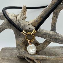 Load image into Gallery viewer, 'Jennifer' is a unique necklace of soft lamb leather, stainless steel fittings and a detachable large baroque shaped Freshwater Pearl.
The pearl is white with silver pink hues and is 18 x 25mm in size
Evelyn is available in Silver, Gold or Rose colors
The length of the leather band is 45cm 