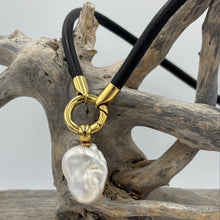 Load image into Gallery viewer, 'Jennifer' is a unique necklace of soft lamb leather, stainless steel fittings and a detachable large baroque shaped Freshwater Pearl.
The pearl is white with silver pink hues and is 18 x 25mm in size
Evelyn is available in Silver, Gold or Rose colors
The length of the leather band is 45cm 