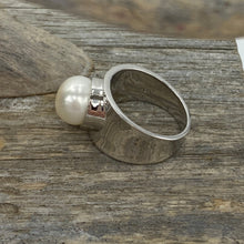 Load image into Gallery viewer, Concave Band Rim Set Ring features a Button Shape 9-10mm Freshwater Pearl, White in Colour.
This is a stunning ring and so comfortable to wear - the pearl is protected and the profile low so ideal for everyday wear
Available in sizes 54 (7 or N) ,56 (O1/2), 58 (8.5 or Q) and 60 (R1/2)