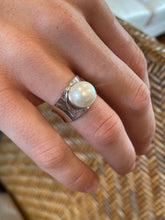 Load image into Gallery viewer, Concave Band Rim Set Ring features a Button Shape 9-10mm Freshwater Pearl, White in Colour.
This is a stunning ring and so comfortable to wear - the pearl is protected and the profile low so ideal for everyday wear
Available in sizes 54 (7 or N) ,56 (O1/2), 58 (8.5 or Q) and 60 (R1/2)