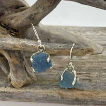 Load image into Gallery viewer, Sterling silver claw set shepherds hook style earrings featuring stunning Rough cut Aquamarine gemstones
The stones vary in shape but are roughly rectangle and 11 x 12mm in size
Team your aquamarine earrings with an aquamarine necklace for a WOW effect