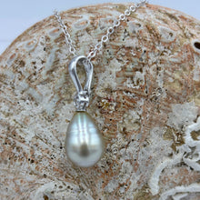 Load image into Gallery viewer, This Fijian South Sea pearl pendant enhancer is set on 925 Sterling silver with a bezel set cubic zirconia for added bling.
The pearl is Champagne in colour with Grey Pink hues making it a very unusual pearl especially combined with its Circle Long Drop shape.
It is 10.7 x 15mm in size, with Good lustre and very light 'birthmarks'
Chain included is Base metal only
J3427