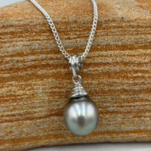 Load image into Gallery viewer, This pearl is an unusual pastel color with shades of Blue and Pink making it soft and wearable with anything. It is Drop shape, 10.5 x 13mm in size and has a natural circle birthmark at the top which blends well with the design of the pendant bail.
It is a stunning pearl with excellent lustre and clean skin
Chain included is Base metal only
J3401
