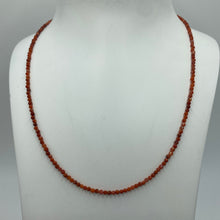 Load image into Gallery viewer, This stunning necklace features 2.5mm facetted Red Bamboo shape Coral beads , with a 925 sterling silver peanut clasp.  It can be used as a necklace on it own or as a chain to hold a pendant.  It is on 49 strand high strength US wire with scrimps for security  Finished length is 46cm
