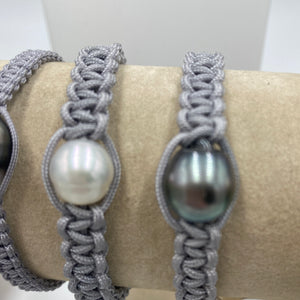 Thick Grey Macrame bracelet featuring an Australian South Sea Pearl, Circle Drop in shape, 10.3 mm in size, White in colour.  (J3319)  This bracelet is made from water and colorfast nylon material for heavy duty wear and tear, features no glue and no metal parts