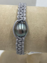 Load image into Gallery viewer, Thick Grey Macrame Bracelet featuring an Tahitian South Sea Pearl, Drop in shape, 11.8 x 13.1mm in size, Blue Green with Aubergine hues in colour. This bracelet is made from colour and water fast nylon material for heavy duty wear and tear, features no metal or glue. (J3318) Pictured on right in photo of three or third from left in group photo