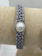 Load image into Gallery viewer, Thick Grey Macrame bracelet featuring an Australian South Sea Pearl, Circle Drop in shape, 10.3 mm in size, White in colour.  (J3319)  This bracelet is made from water and colorfast nylon material for heavy duty wear and tear, features no glue and no metal parts
