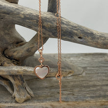 Load image into Gallery viewer, Our 'Beloved' pendant is 18K rose gold-plated sterling 925 silver earrings with elegant mother-of-pearl. The stunning heart shape Mother of Pearl shell glistens in the light and is highlighted by the sparkle of the cubic zirconia above
Chain length is adjustable at either 40cm or 45cm
The pendant itself measures 20mm from the top to bottom.