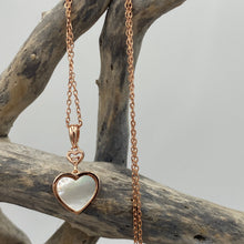 Load image into Gallery viewer, Our 'Beloved' pendant is 18K rose gold-plated sterling 925 silver earrings with elegant mother-of-pearl. The stunning heart shape Mother of Pearl shell glistens in the light and is highlighted by the sparkle of the cubic zirconia above
Chain length is adjustable at either 40cm or 45cm
The pendant itself measures 20mm from the top to bottom.
