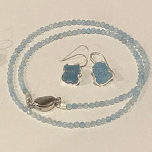 Load image into Gallery viewer, <p>Sterling silver claw set shepherds hook style earrings featuring stunning Rough cut Aquamarine gemstones</p> <p>The stones vary in shape but are roughly rectangle and 11 x 12mm in size</p> <p>Team your aquamarine earrings with an aquamarine necklace for a WOW effect</p>