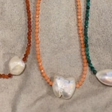 Load image into Gallery viewer, <p><span>This necklace features a white Freshwater Keshi or seedless Pearl on a necklace of 2.5mm facetted Orange Bamboo Coral gemstones with a sterling silver peanut clasp</span></p> <p><span>The pearl is 12.5 x 15mm in size</span></p> <p>The overall length is 46cm</p> <p>Other gemstone necklaces can be made to order</p> <p> </p>