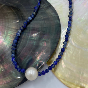 <p><span>This necklace features a white Freshwater Pearl&nbsp; on a necklace of 3.5mm facetted Lapis gemstones with a sterling silver peanut clasp</span></p> <p><span>The pearl is 9.5 x 10.5mm in size</span></p> <p>The overall length is 43cm</p> <p>Other gemstone necklaces can be made to order</p>