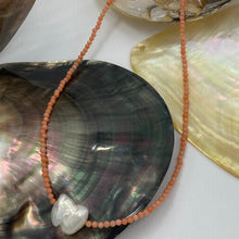 Load image into Gallery viewer, <p><span>This necklace features a white Freshwater Keshi or seedless Pearl on a necklace of 2.5mm facetted Orange Bamboo Coral gemstones with a sterling silver peanut clasp</span></p> <p><span>The pearl is 12.5 x 15mm in size</span></p> <p>The overall length is 46cm</p> <p>Other gemstone necklaces can be made to order</p>