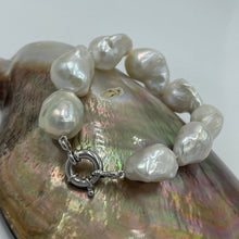 Load image into Gallery viewer, Freshwater pearl bracelet featuring High lustre Baroque pearls, stunning white in colour 15-30mm in size, 20.5cm in length, with a bolt ring sterling silver clasp Matching strand available and these can be joined together to make a 66.5cm strand INS