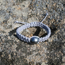 Load image into Gallery viewer, Thick Grey Macrame Bracelet featuring an Tahitian South Sea Pearl, Drop in shape, 11.8 x 13.1mm in size, Blue Green with Aubergine hues in colour. This bracelet is made from colour and water fast nylon material for heavy duty wear and tear, features no metal or glue. (J3318) Pictured on right in photo of three or third from left in group photo