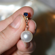 Load image into Gallery viewer, Stunning handcrafted 9ct yellow gold earrings featuring studs of Blue sapphires, 4mm round and claw set. Under this is 9ct chain joining to our highest grade White South Sea Pearls. They are 11.4mm, Round in shape White with pink hues, AAA grade lustre and skin
30mm from top to bottom 