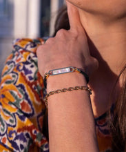 Load image into Gallery viewer, Stunning new range of Ladies Stainless steel and nautical rope jewellery, hand made in Amsterdam and designed with strength to be worn 24/7
This stunning rope Mother of Pearl shell bracelet with Sky Blue rope and Silver fittings is the perfect bracelet for a touch of glowing shell teamed with the classy rope and durability of stainless steel setting around the pearl shell
One size
Also available in other colors
Mix and match or stack with other Pig and Hen bracelets 