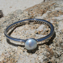 Load image into Gallery viewer, Sterling Silver solid bangle featuring an Australian South Sea Pearl This stunning pearl is an Australian South Sea pearl, Button in shape and 14.3mm in size. It is White with Silver Pink hues and is featured on this rhodiun coated non tarnish bangle J3293