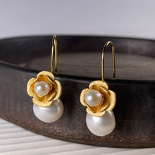 Load image into Gallery viewer, 18K gold plated satin finish over 925 sterling silver hook style earrings Featuring a 5mm white Freshwater pearl in the flower and a 9 x 15mm Drop shaped White Freshwater pearl underneath This pearl can be detached from the hook so the earrings can be worn just with the flower as an alternative option. FS091