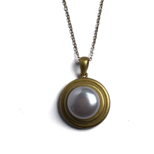 Load image into Gallery viewer, 18K gold plated over 925 sterling silver pendant and chain  Satin finish pendant with White Freshwater 12-12.5mm Button shape pearl in the centre  Pendant is 25mm from top to bottom in height  Adjustable chain 40-46cm
