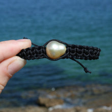 Load image into Gallery viewer, Thick Black Macrame bracelet featuring an Indonesian South Sea Pearl, Circle Drop in shape, 13.2 x 14.8mm in size, Gold in colour, high lustre and clean skin.  (J3317)  This bracelet is made from water and colorfast nylon material for heavy duty wear and tear, features no glue and no metal parts   
