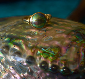 This New Zealand Eyris Blue Pearl ring is set in 9ct yellow gold and&nbsp;features a 10mm bezel set New Zealand paua mabe pearl, blue green in color.&nbsp;

Order to your size and choice of silver or gold

There is a range of unset Abalone pearls in stock that could be Made to Order - feel free to enquire about these as Sirene Sea Pearls is an agent for NZ Abalone Pearls in Australia